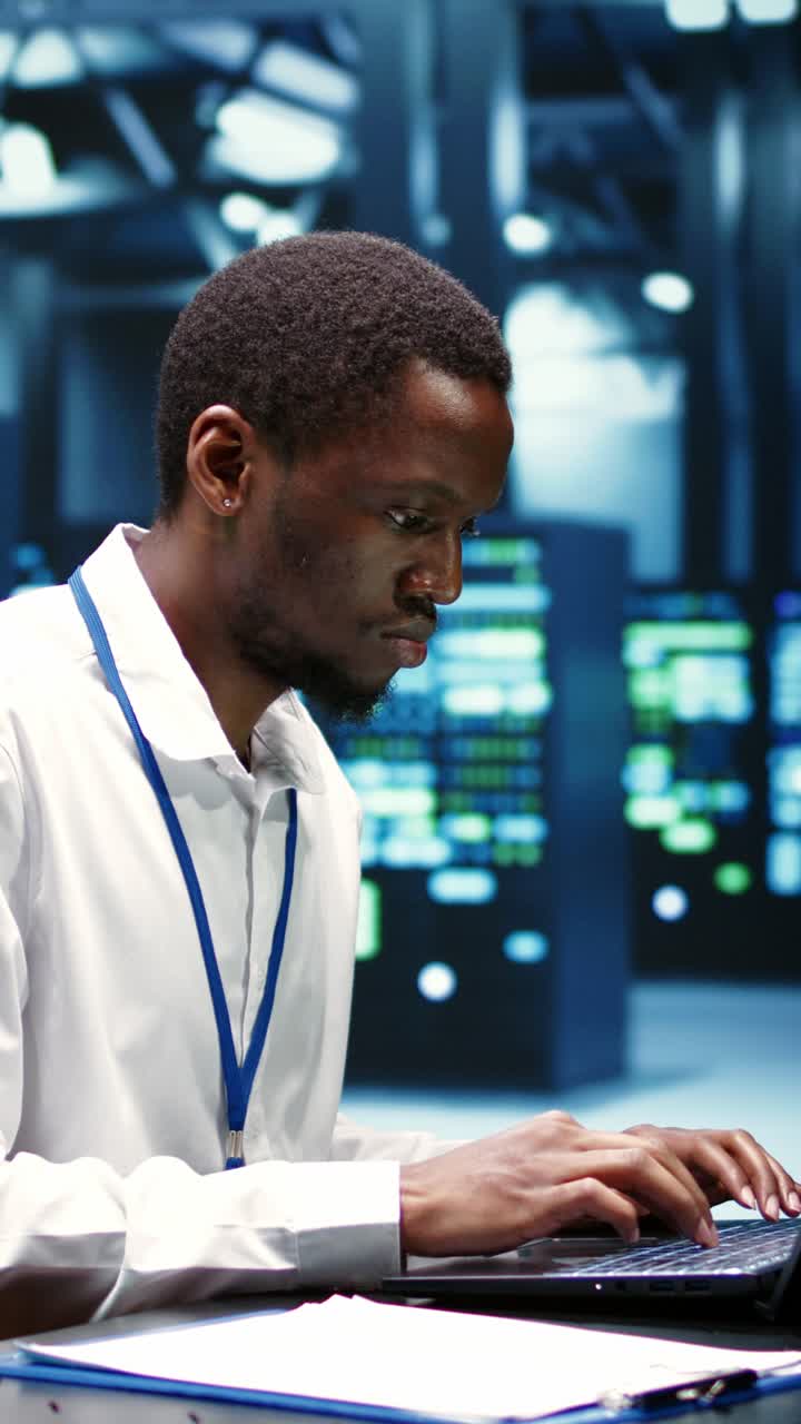 Vertical video Computer scientist fixing server issues
