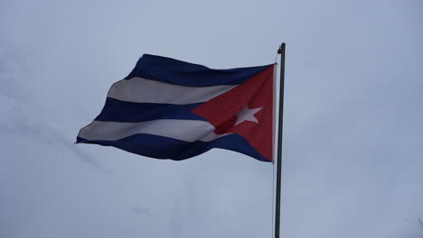 a cuban flag waving in the wind