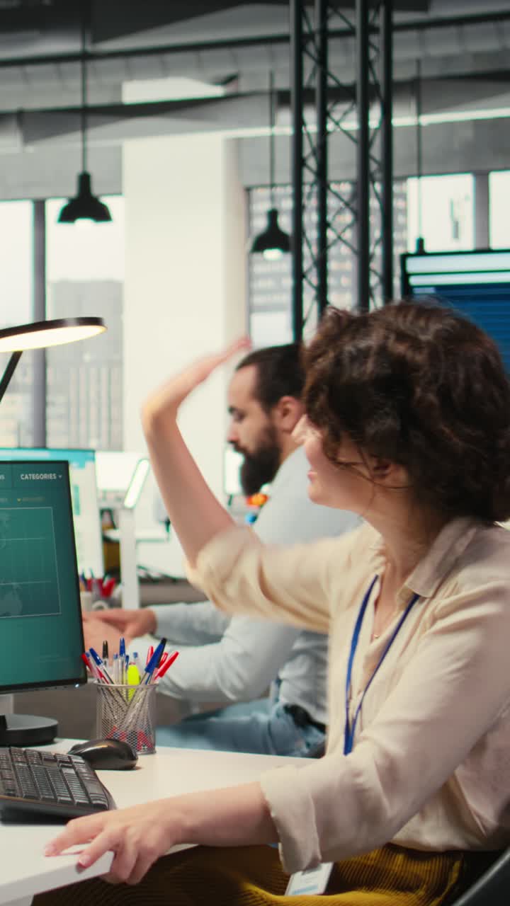 Vertical Video Happy colleagues sharing a high five after successful tasks accomplishment