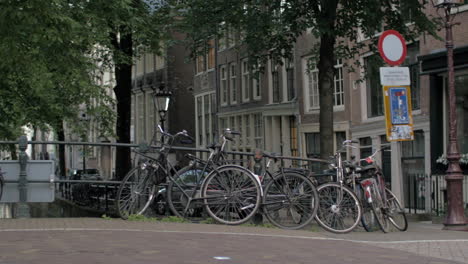 bicycles parked on the bridge in amsterdam