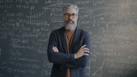 Professor in front of a chalkboard full of equations