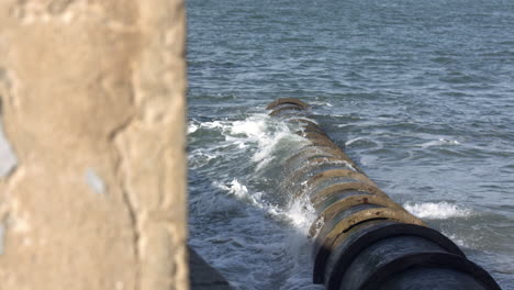 Water-line-draining-into-the-river-and-waves