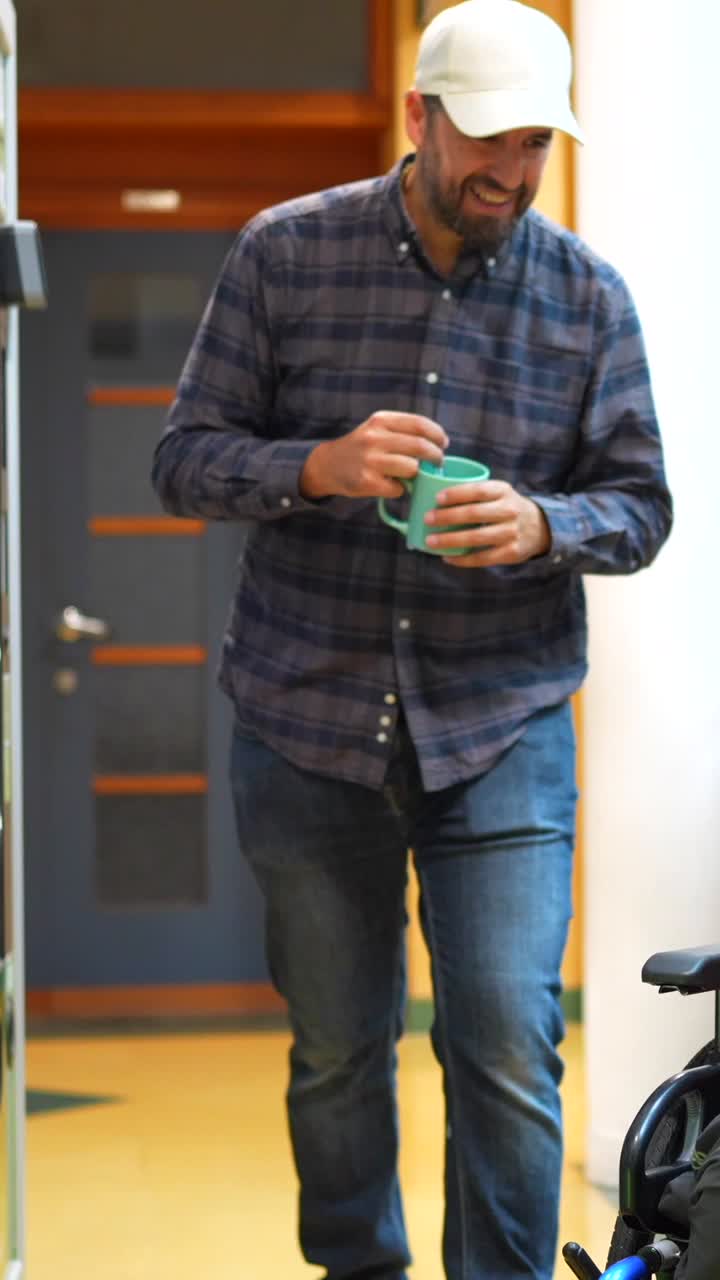 Two men in a bright room