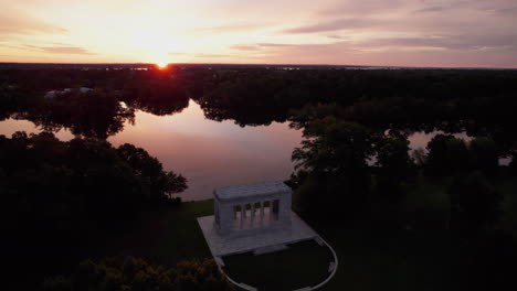 aerial view of an orange sunset over the roger williams park temple to music