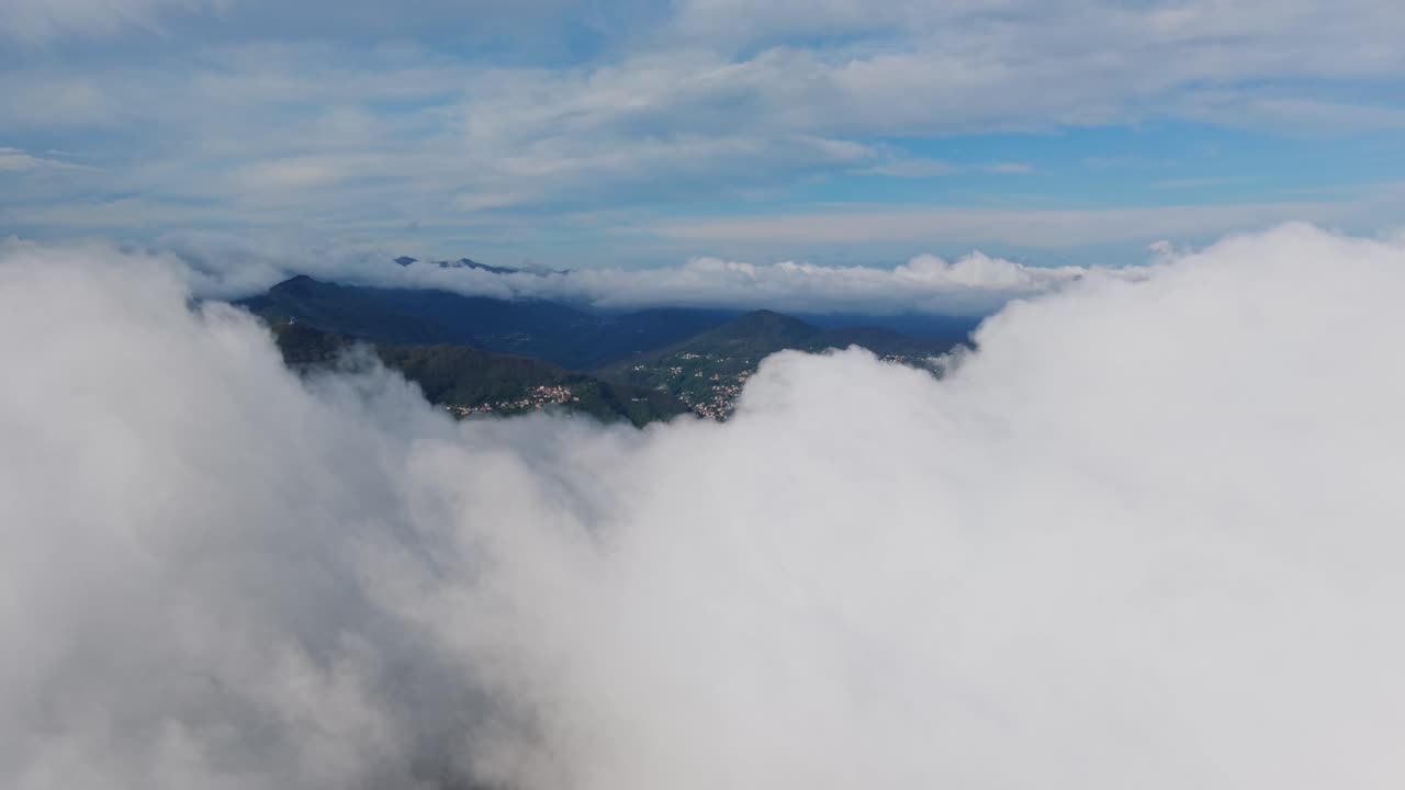 Big clouds above lush green mountains, aerial view of scenic landscape with nature’s beauty