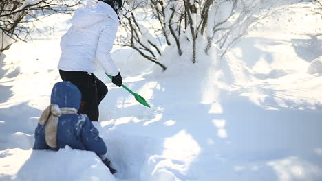 Mother and son walking in winter. Mother and son spending time together in winter day