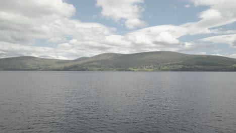 Scenic-View-Of-Mountains-And-Sea-In-Blessington-Lake-In-Wicklow-Ireland---aerial-shot