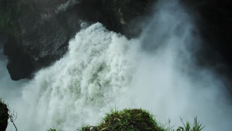 nile river waterfall with water mist in slow motion, uganda, africa