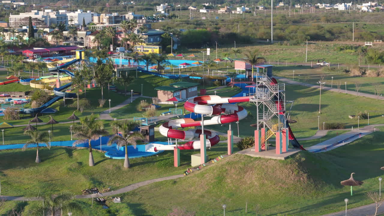 Aerial drone scene capturing the panoramic view of federacion city in entre rios province, argentina, highlighting its famous thermal resorts and lush green landscapes