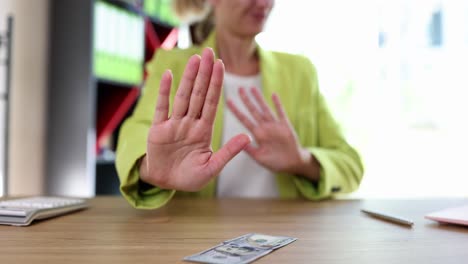 Woman refusing money as a bribe