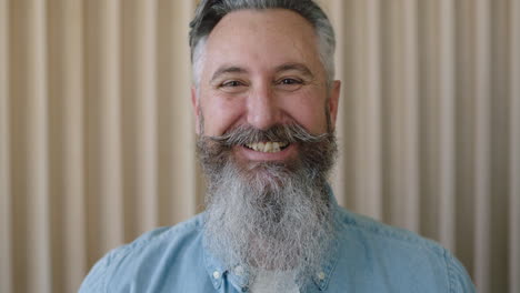 close-up-portrait-of-mature-caucasian-man-stylish-beard-laughing-cheerful-looking-at-camera-enjoying-successful-lifestyle