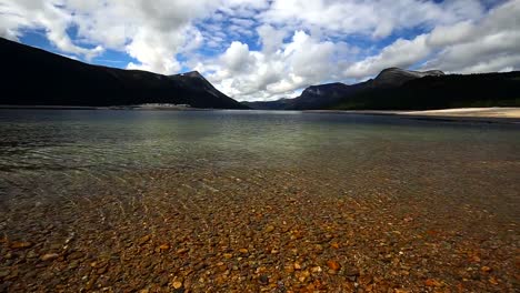 Crystal-clear-waters-of-Gjevilvatnet-lake,-high-in-the-mountains-of-Trollheimen-national-park-in-Norway