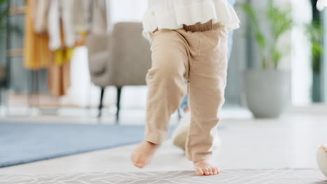 baby learning to walk in home