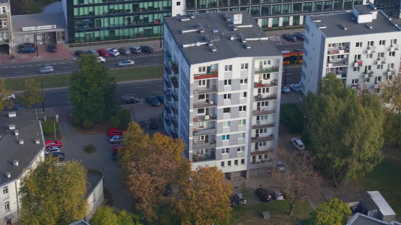 Warsaw, Poland. Aerial View of Street Traffic on Sunny Autumn Day, Tram and Cars on Street, Drone Shot