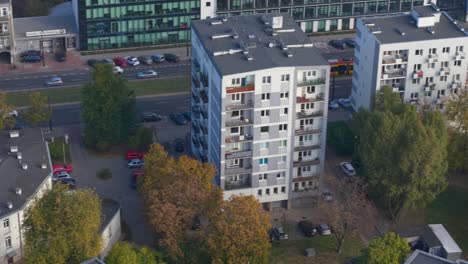 warsaw, poland. aerial view of street traffic on sunny autumn day, tram and cars on street, drone shot