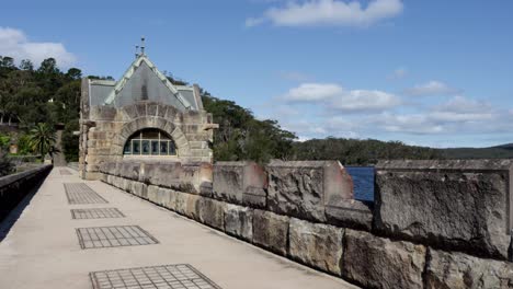 an old historic building at the center of the dam wall