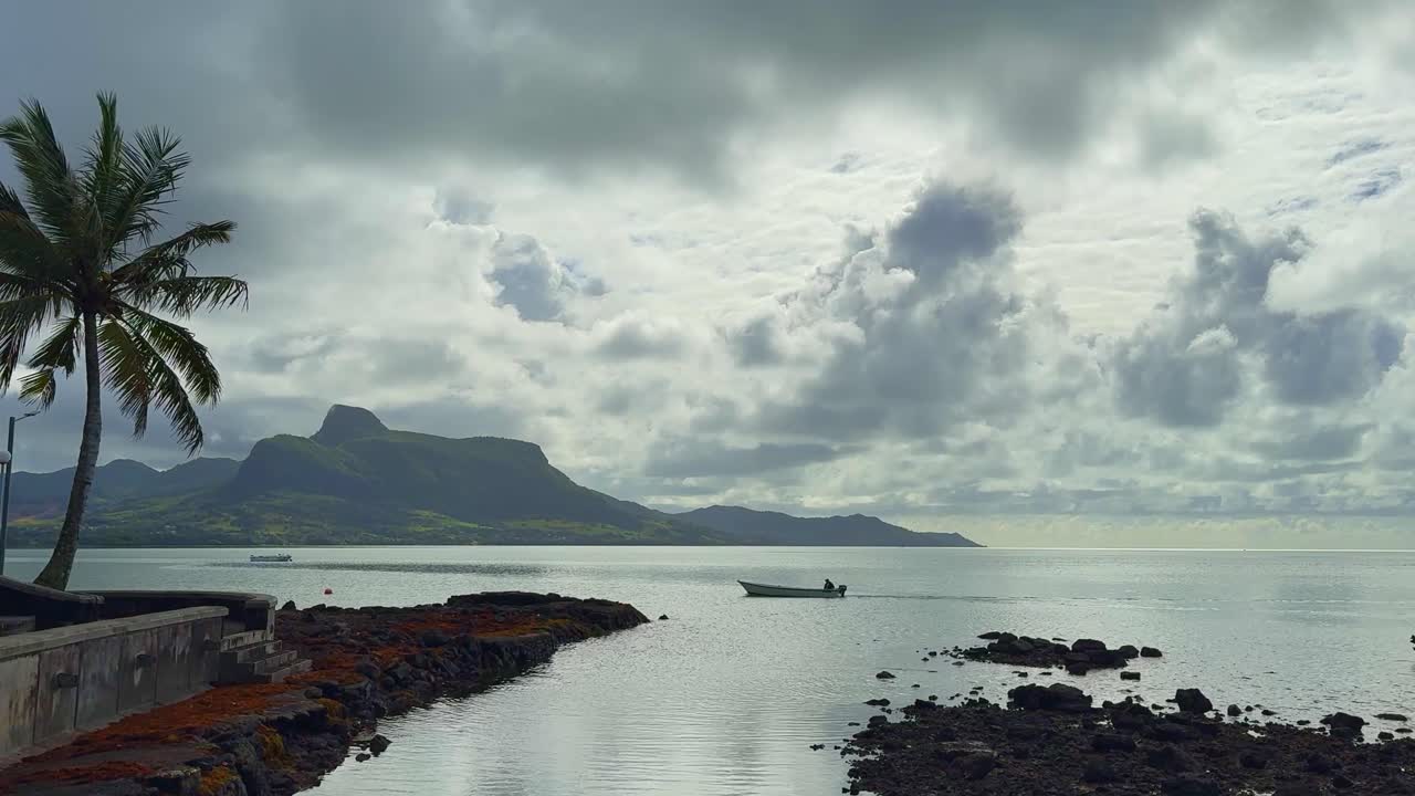 A small fishing boat on the water in Mauritius 4K
