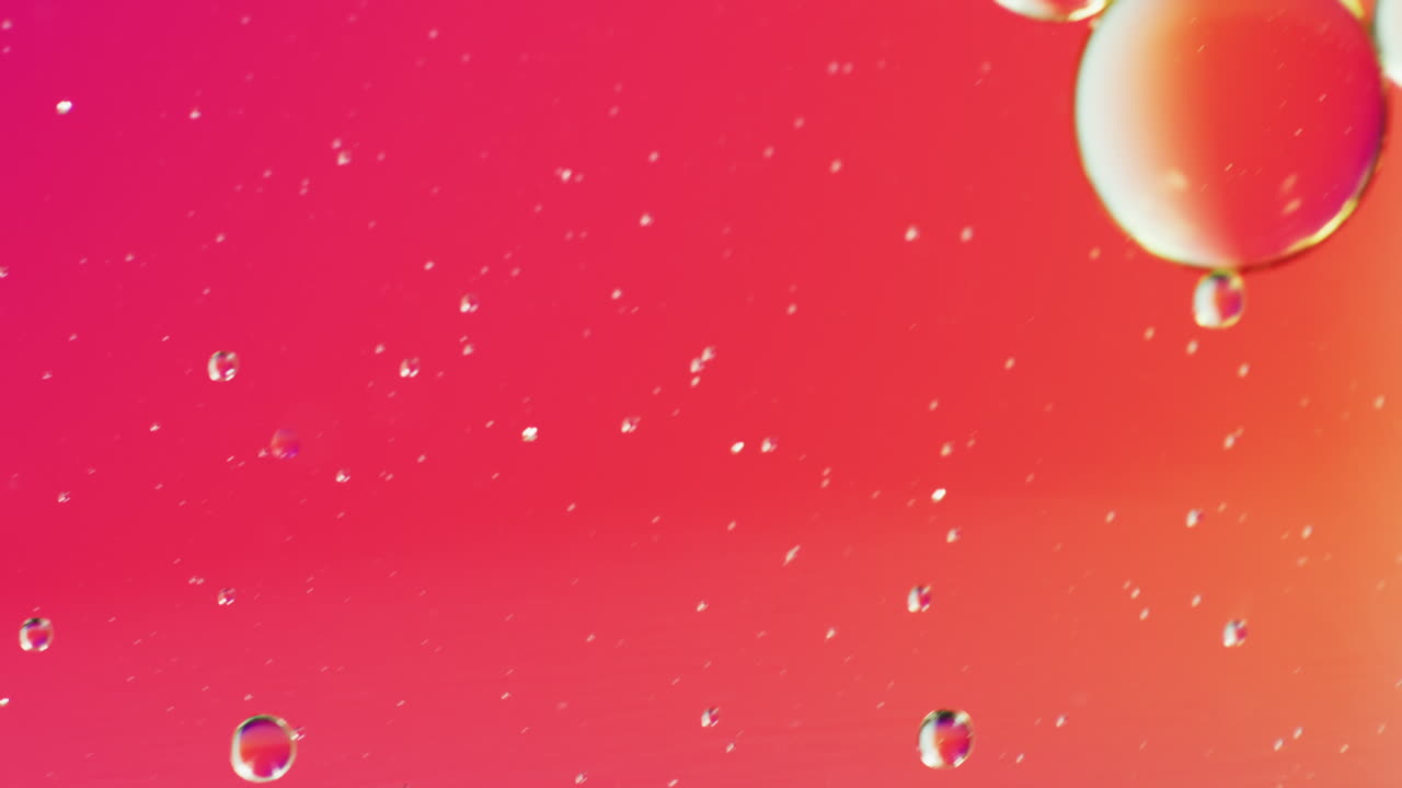 Animation of bubbles moving on red background with copy space