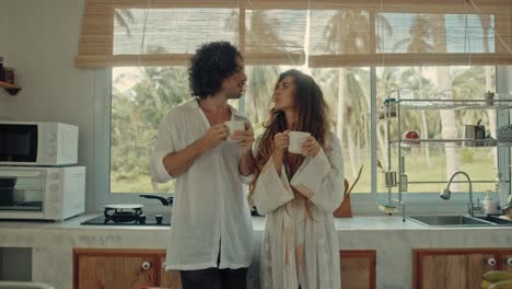 couple enjoying coffee in a cozy kitchen