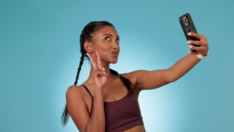 woman, fitness selfie and studio with peace sign