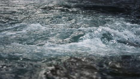 river water flowing in mountain river. rapid water stream in slow motion