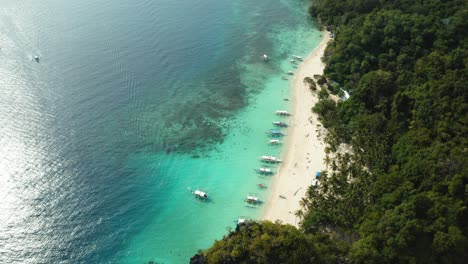 WS-AERIAL-HA-Beach-with-boats-and-sea,-El-Nido,-Palawan,-Philippines