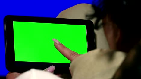 business woman using a tablet touchscreen chroma key- close-up , fingers make gestures touching and swiping the screen of a modern tablet. uhd stock video, alpha matte included