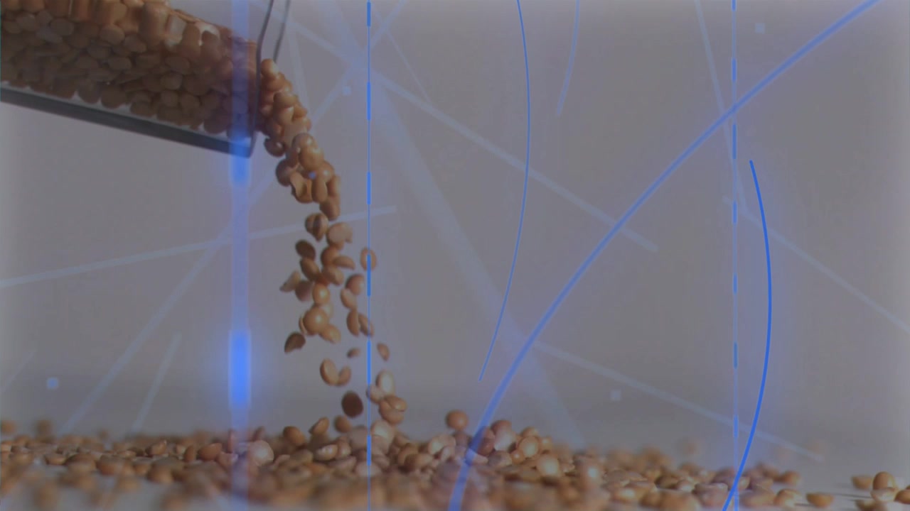 動作研究のため、金属製の容器が傾いて茶色の豆をトレイに注ぎ、青い弧が描かれる。