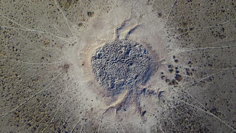 aerial view of a dry waterhole with game trails in the arid kalahari region of southern africa-1