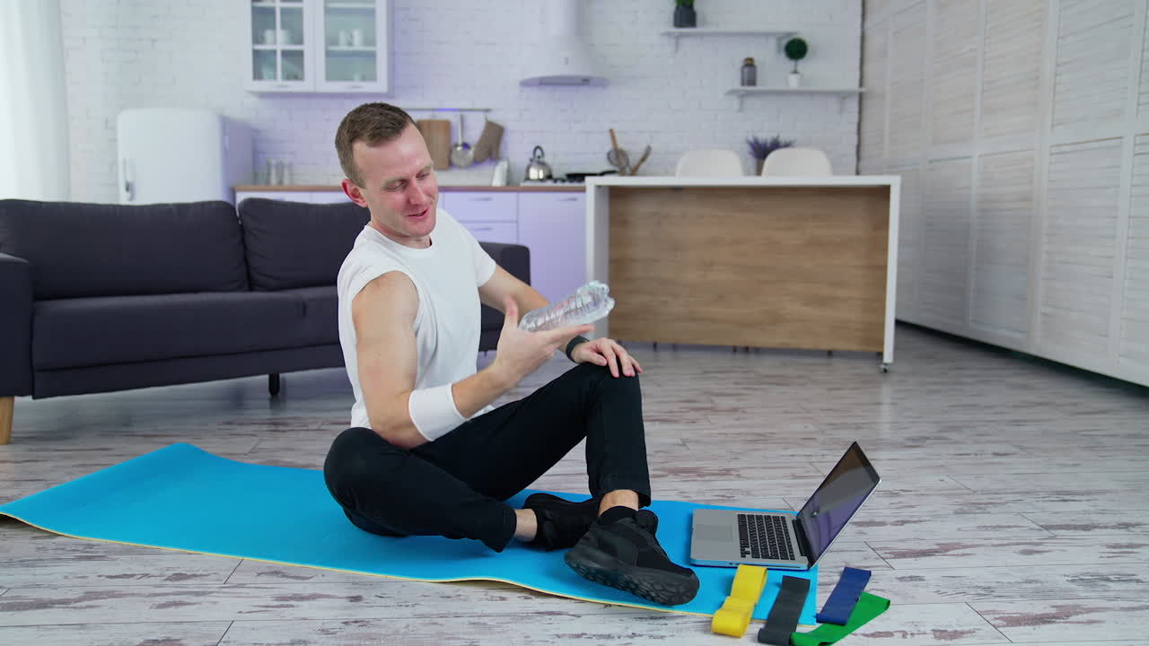 Sporty handsome man doing exercise at home. Quarantine isolation indoor training.