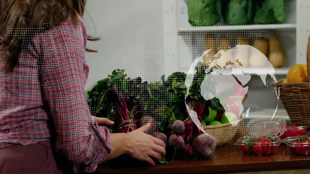 Woman reaching for bundled market beets sorting bunches for display showing stems overlaying right