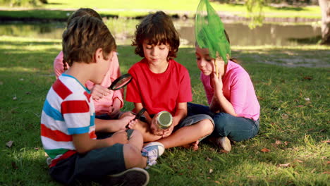 happy little friends looking at jar