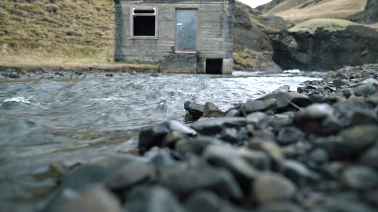 Low Level View of Hut by a Stream