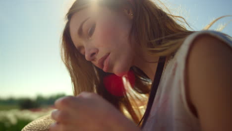 Serious-woman-working-with-camera-outdoors.-Thoughtful-woman-checking-device.