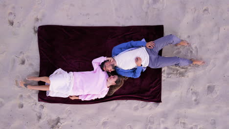 aerial view of couple laying outdoors