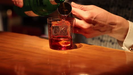 sequence of pouring whiskey into a glass