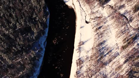 drone flight over the sea in winter frozen rocks on the coast