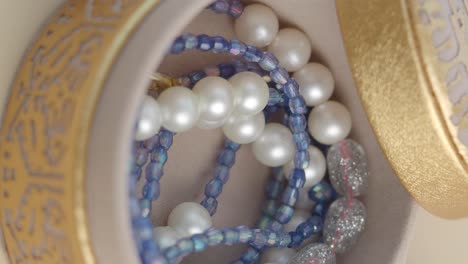 elegant pearls and beaded jewelry in a decorative box