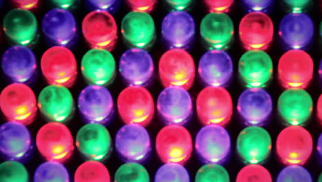 a rack focus macro shot of led lights, changing their color following a crazy fast pattern