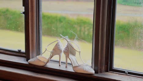 wedding shoes on a window