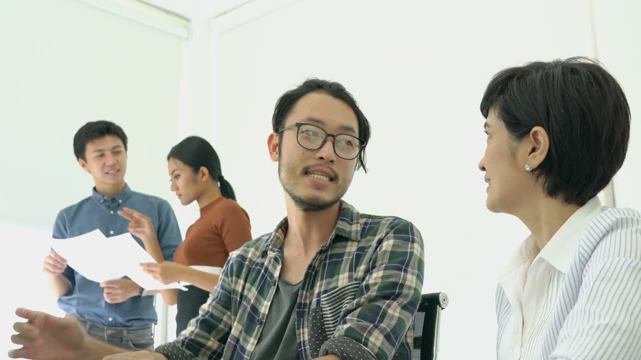 Designer artist suggest ideas to creative manager and meeting together on monitor green screen. Concept of employee design and development.