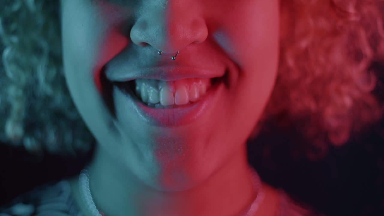 Close-up of a woman's face with neon lighting and different expressions