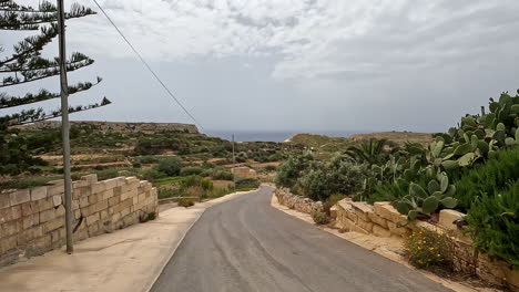 shot of road leading up to the majestic coastline of malta island on a cloudy day