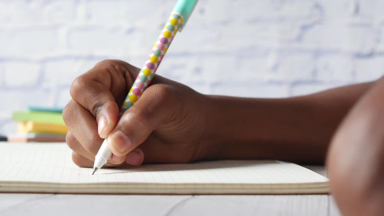 Child writing in a notebook
