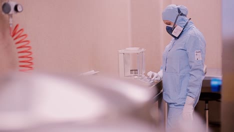 scientist weighing material in laboratory