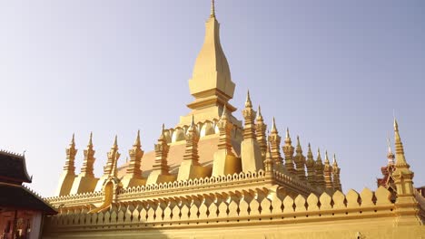 Looking-up-at-Pha-That-Luang-Golden-Stupa-Buddhist-Temple-in-Vientiane,-Laos