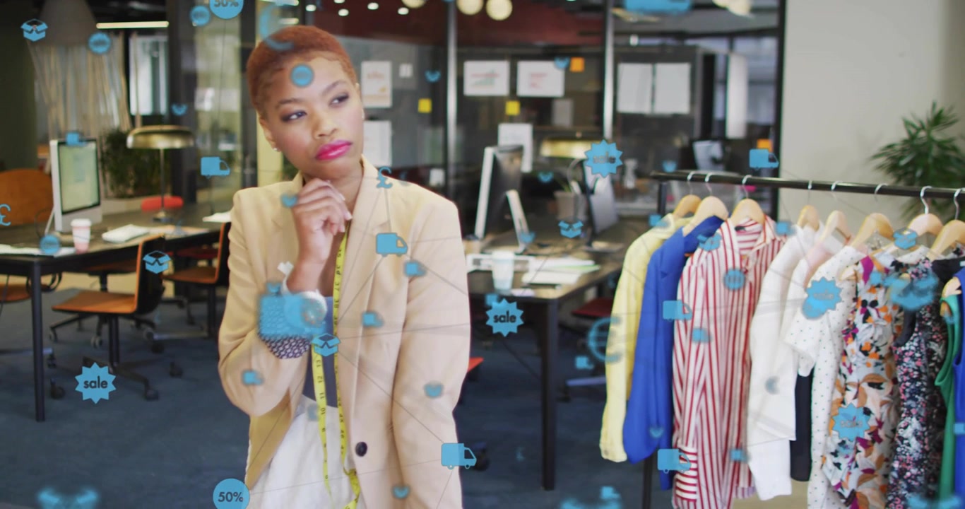Fashion designer studying fabric swatches while icons fading in around her guiding retail decision