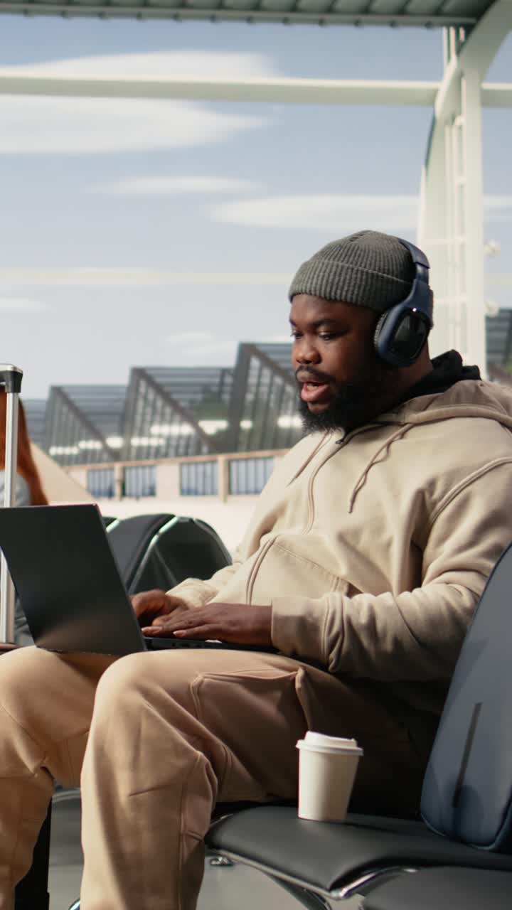 Vertical Video African American Man On Video Conference Call Using Airport Internet
