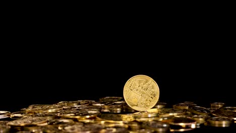 gold digital coin spins and falls on stacked tokens, dramatic lighting, black background, static camera