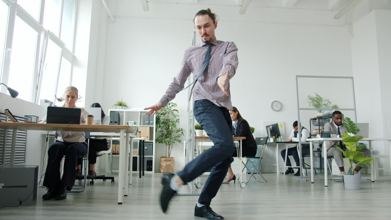 Man Dancing in Office